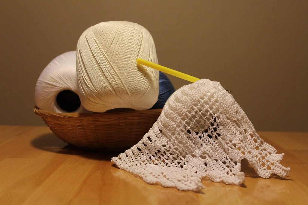 Discover the true yarn definition and learn how individual raw fibers are spun together to create the strands behind your favorite sweaters and crochet projects.